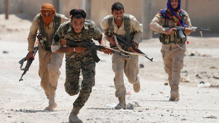 <p>Kurdish fighters from the People&#8217;s Protection Units (YPG) run across a street in Raqqa, Syria, July 3, 2017. Goran Tomasevic: &#8220;They were members of Kurdish YPG militia. They were running across the street because ISIS fighters&#8217; positions were nearby. I shot the picture in a last day of my assignment. I was lucky to have that picture as YPG fighters were giving very restricted access to media.&#8221; REUTERS/ Goran Tomasevic/File Photo SEARCH &#8220;POY IS&#8221; FOR THIS STORY. SEARCH &#8220;REUTERS POY&#8221; FOR ALL BEST OF 2017 PACKAGES. TPX IMAGES OF THE DAY &#8211; RC164AFF4C20</p>
