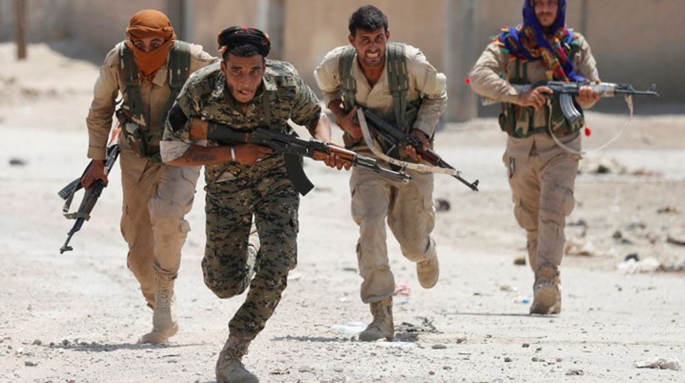<p>Kurdish fighters from the People’s Protection Units (YPG) run across a street in Raqqa, Syria, July 3, 2017. Goran Tomasevic: “They were members of Kurdish YPG militia. They were running across the street because ISIS fighters’ positions were nearby. I shot the picture in a last day of my assignment. I was lucky to have that picture as YPG fighters were giving very restricted access to media.” REUTERS/ Goran Tomasevic/File Photo SEARCH “POY IS” FOR THIS STORY. SEARCH “REUTERS POY” FOR ALL BEST OF 2017 PACKAGES. TPX IMAGES OF THE DAY – RC164AFF4C20</p>
