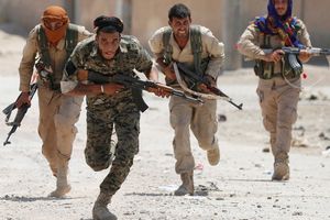 <p>Kurdish fighters from the People’s Protection Units (YPG) run across a street in Raqqa, Syria, July 3, 2017. Goran Tomasevic: “They were members of Kurdish YPG militia. They were running across the street because ISIS fighters’ positions were nearby. I shot the picture in a last day of my assignment. I was lucky to have that picture as YPG fighters were giving very restricted access to media.” REUTERS/ Goran Tomasevic/File Photo SEARCH “POY IS” FOR THIS STORY. SEARCH “REUTERS POY” FOR ALL BEST OF 2017 PACKAGES. TPX IMAGES OF THE DAY – RC164AFF4C20</p>
