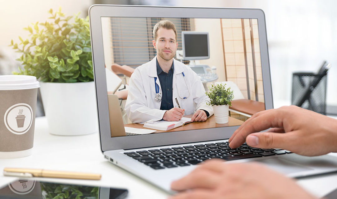 <p>Doctor with a stethoscope on the computer laptop screen. Telemedicine or telehealth concept.</p>
