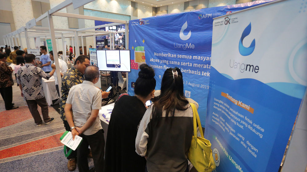 <p>Suasana stand peserta pameran Fintech di Manado, Sulawesi Utara. foto: Ismail Pohan/TrenAsia</p>

