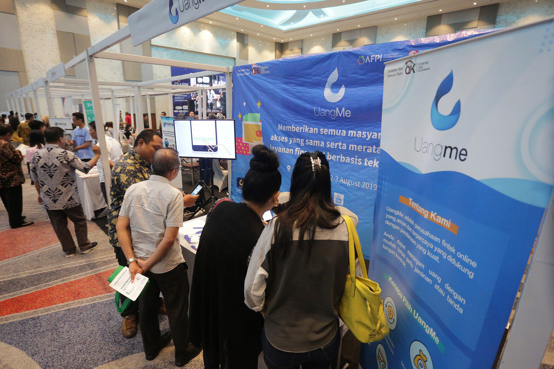 <p>Suasana stand peserta pameran Fintech di Manado, Sulawesi Utara. foto: Ismail Pohan/TrenAsia</p>
