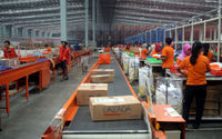 Pekerja menyiapkan barang pesanan untuk dikirimkan kepada pembeli di gudang toko daring Lazada di Cimanggis, Depok, Jawa Barat, Selasa (23/5). Untuk mengimbangi perkembangan. 