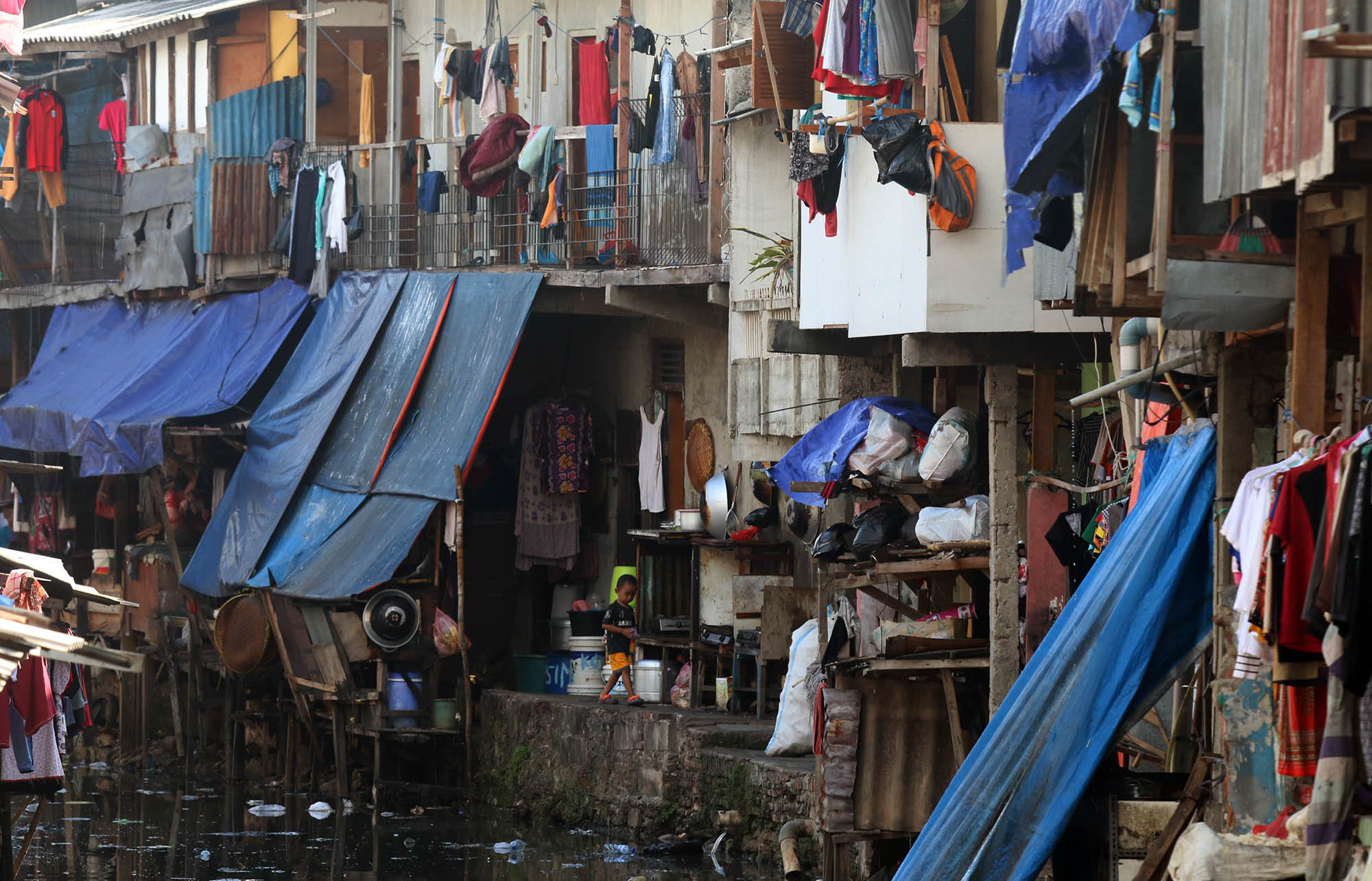 <p>Ilustrasi: Suasana pemukiman padat warga di kawasan Kebun Melati, Tanah Abang, Jakarta Pusat. Foto: Ismail Pohan/TrenAsia</p>
