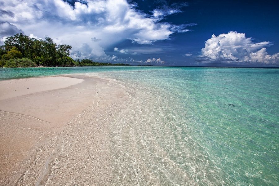 <p>Ilustrasi pasir pantai di sebuah pulau. / Pixabay</p>
