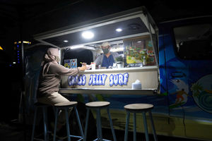 <p>Berni (47) bersama istrinya Arianti (36) berada di gerai foodtruck “Grass Jelly Surf” miliknya yang menjual minuman segar di area perkantoran Cibis Park, kawasan TB Simatupang, Jakarta Selatan, Kamis, 13 Agustus 2020. Bisnis yang sudah dirintis selama 6 tahun ini, masih berusaha bertahan ditengah hantaman pandemi. Sepinya event dan kegiatan komunitas foodtruck membuat Berni harus rela kehilangan omset yang selama ini diraup dari hasil usahanya yang termasuk dalam Usaha Mikro Kecil Menengah (UMKM) mitra binaan Pertamina tersebut. Pria yang berlatar belakang Chef di sebuah kapal pesiar selama 2 tahun ini, berharap pemerintah khususnya wadah binaan seperti Pertamina bisa memberikan perhatian khusus kepada pelaku UMKM yang terdampak pandemi Covid-19 untuk tetap hidup di bidang usahanya dengan bantuan yang nyata menyasar pada suplai produk yang mereka pasarkan. Karena selama ini mereka hanya gencar ditawarkan bantuan berupa pinjaman dana yang justru dianggap semakin menambah beban kedepannya. Foto: Ismail Pohan/TrenAsia</p>
