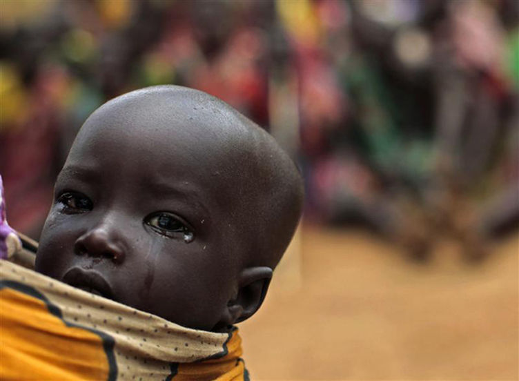 <p>Seorang anak suku Dadinga di Sudan Selatan yang menunggu bantuan PBB/Reuters</p>
