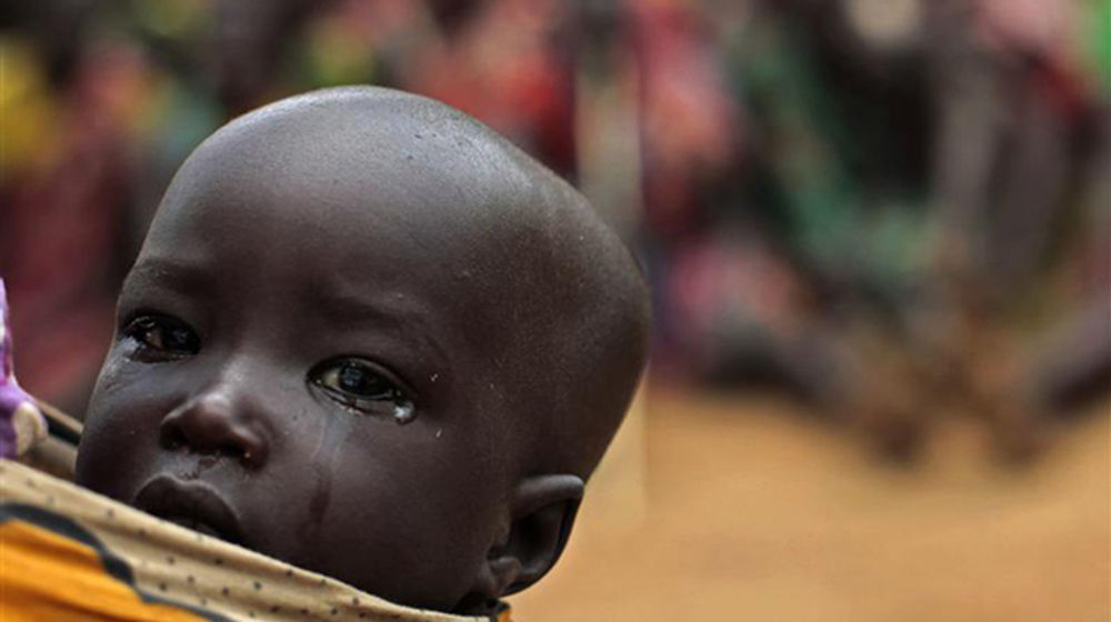 <p>Seorang anak suku Dadinga di Sudan Selatan yang menunggu bantuan PBB/Reuters</p>
