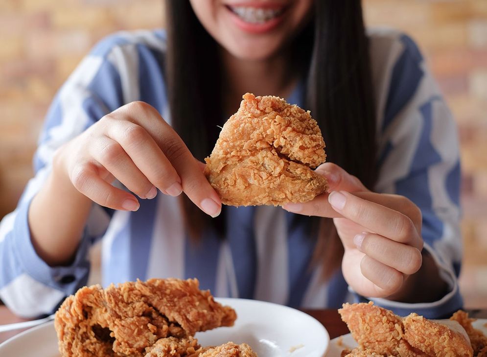 Eating Fried Chicken.