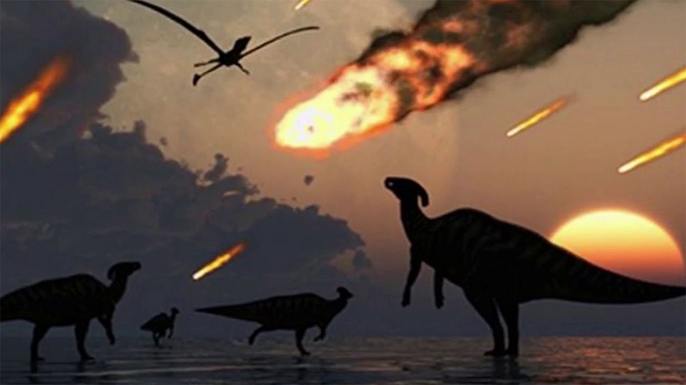 <p>ilustrasi dinosaurus dan hantaman meteor/ google</p>
