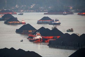 Coal barges are pictured as they queue to be pulled along Mahakam river in Samarinda, East Kalimantan province, Indonesia, August 31, 2019.jpg