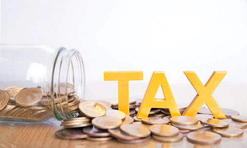 tax-concept-word-tax-put-coins-glass-bottles-with-coins-inside-white-background_38391-198.webp