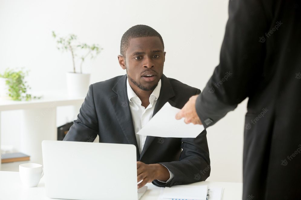surprised-shocked-african-businessman-getting-unexpected-notice-from-caucasian-colleague_1163-3913.jpg