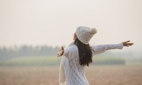 happy-woman-enjoying-idyllic-nature-celebrating-freedom-rising-her-arms_1150-7075.jpg