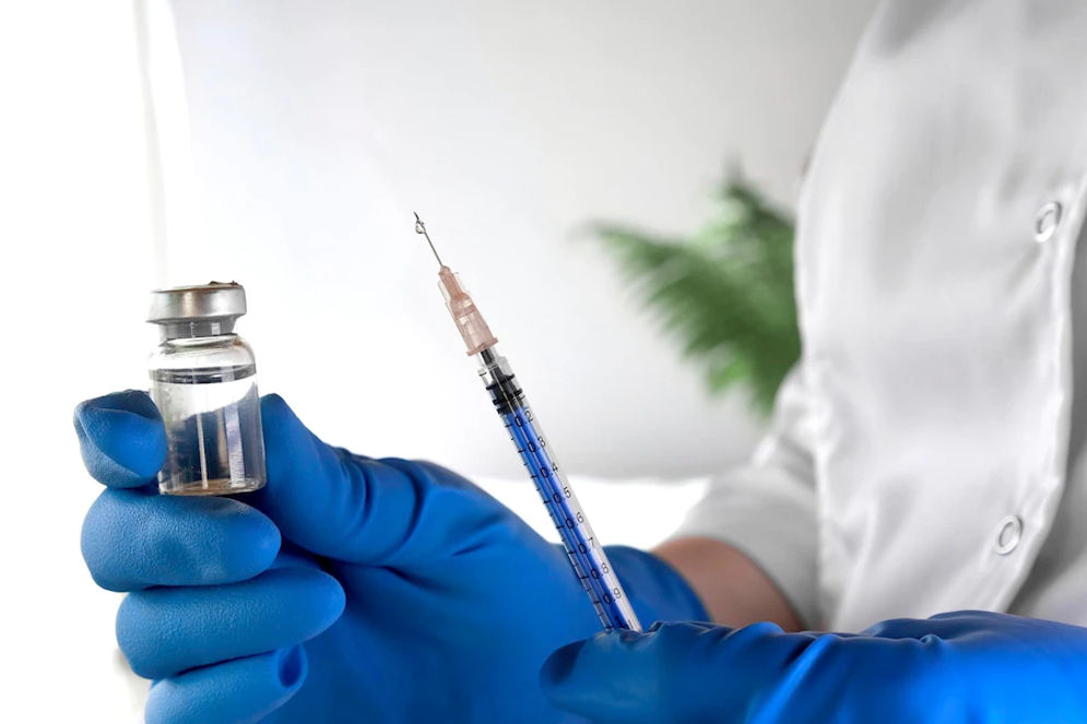 nurse-holds-syringe-vaccine-bottle-his-hand-close-up-doctor-ready-give-injection-science-medical-cosmetology-beauty-treatment-skin-care-concept-covid-19-monkeypox-vaccination_497537-1363.webp