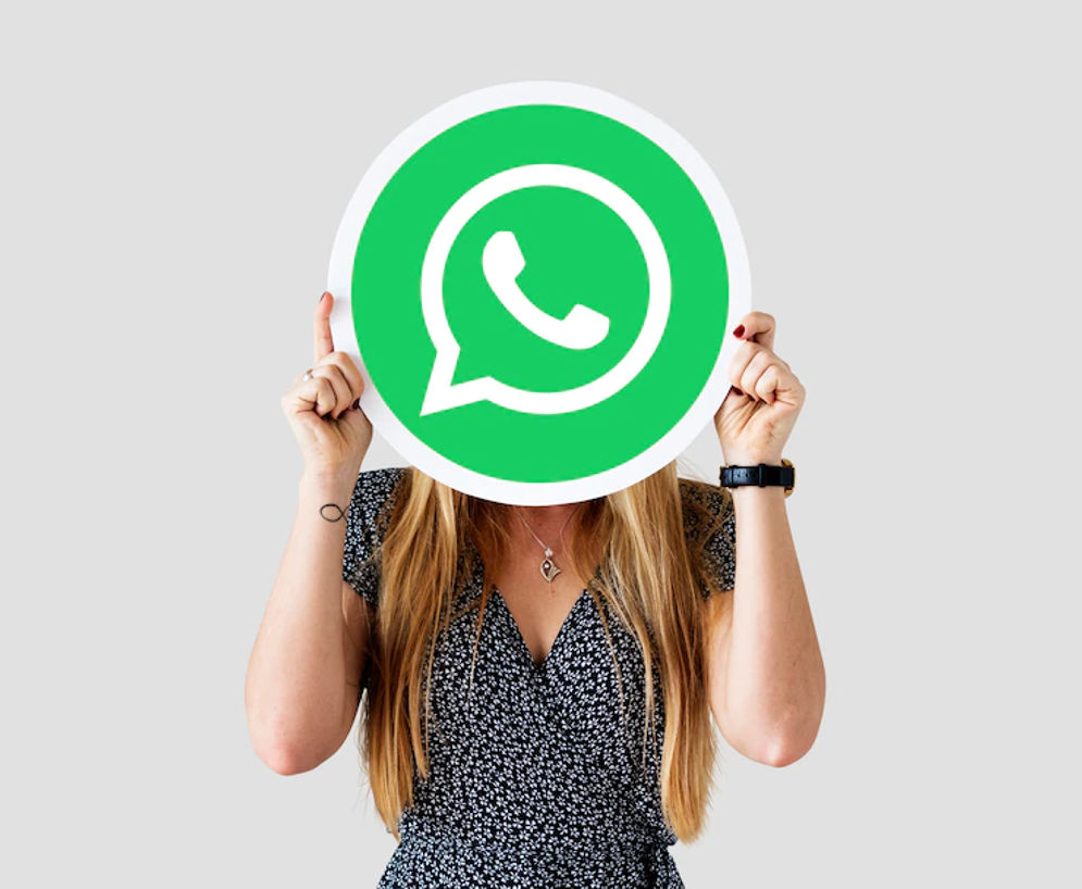 woman-showing-whatsapp-messenger-icon_53876-41312.webp