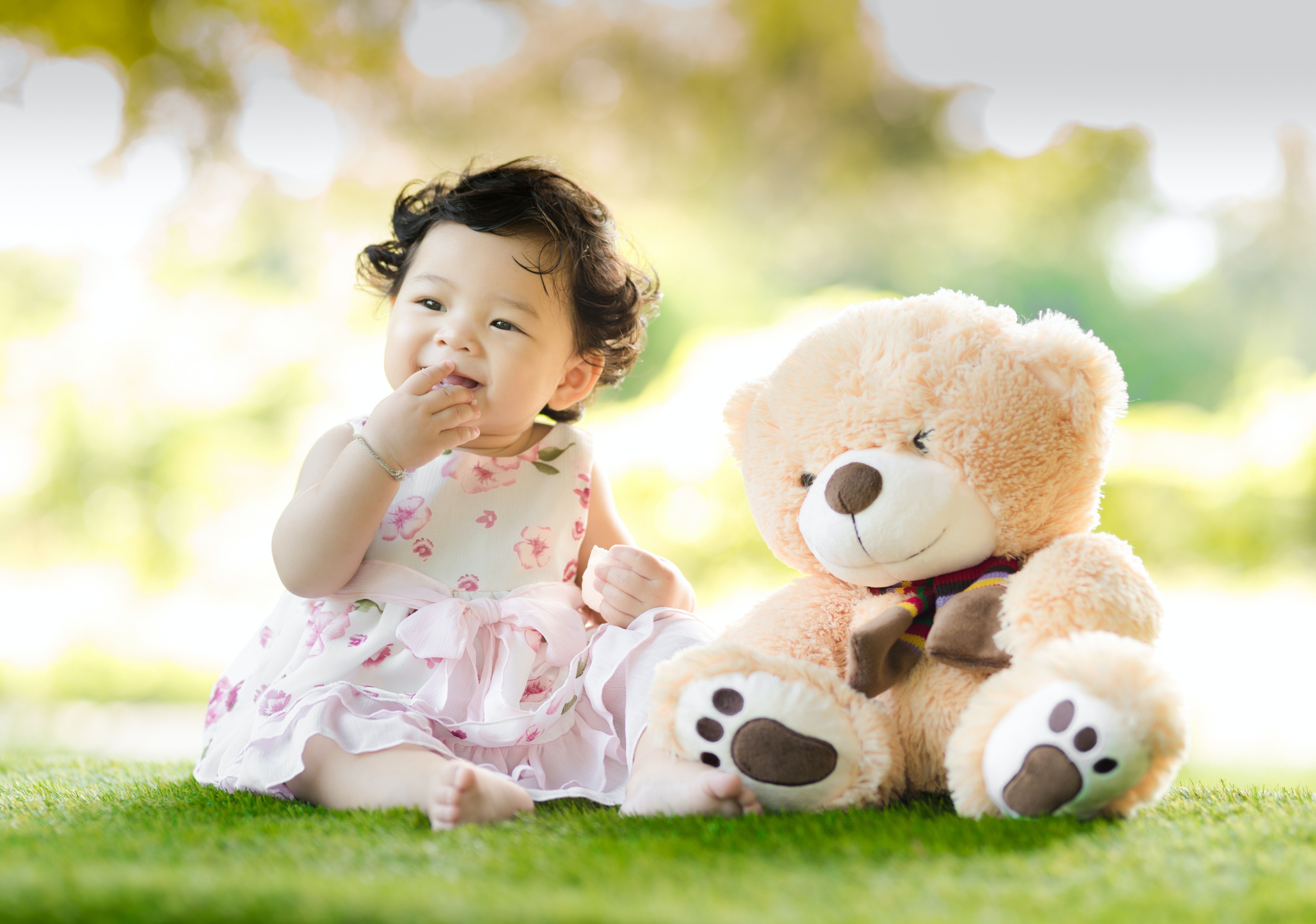 Photo by Singkham: https://www.pexels.com/photo/baby-sitting-on-green-grass-beside-bear-plush-toy-at-daytime-1166473/