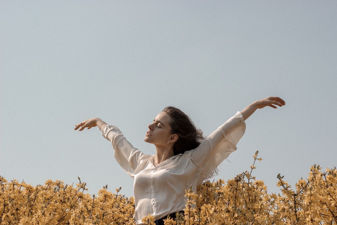 Photo by Maksim Goncharenok: https://www.pexels.com/photo/woman-at-a-flower-field-4348589/