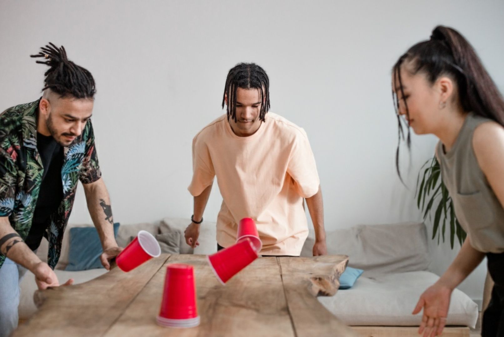 Photo by Ron Lach : https://www.pexels.com/photo/group-of-friends-playing-using-red-plastic-cups-8368342/
