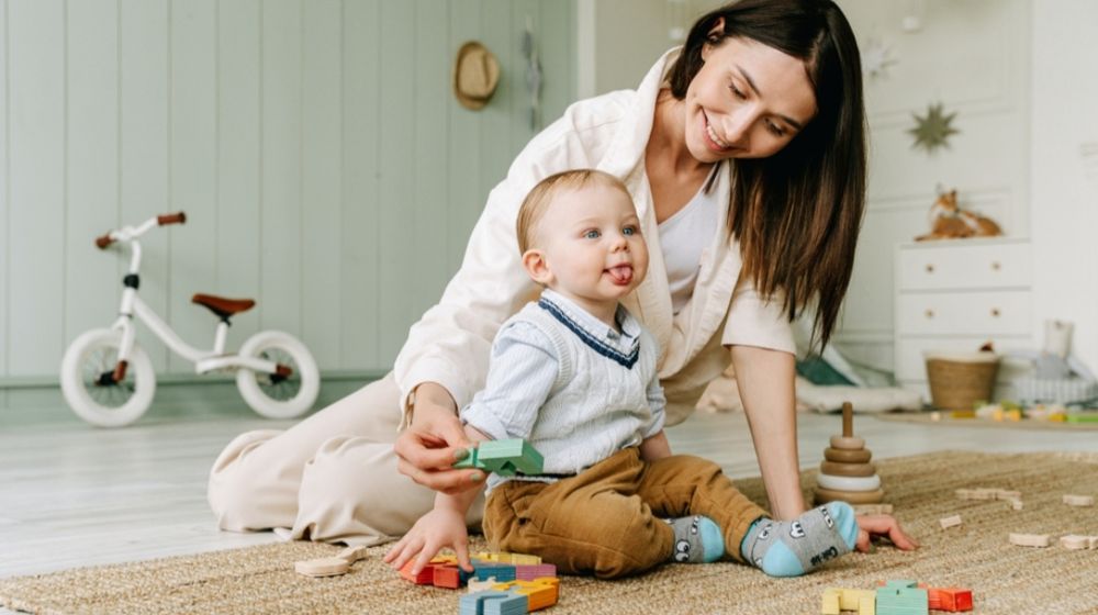 Photo by Ivan Samkov: https://www.pexels.com/photo/baby-boy-sitting-on-floor-with-tongue-out-8504293/