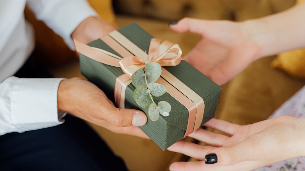 Photo by Antoni Shkraba: https://www.pexels.com/photo/person-giving-a-gift-box-5493207/