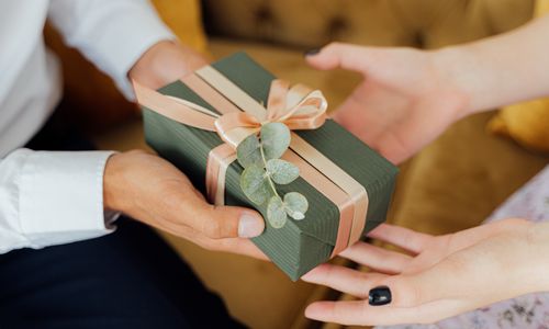 Photo by Antoni Shkraba: https://www.pexels.com/photo/person-giving-a-gift-box-5493207/