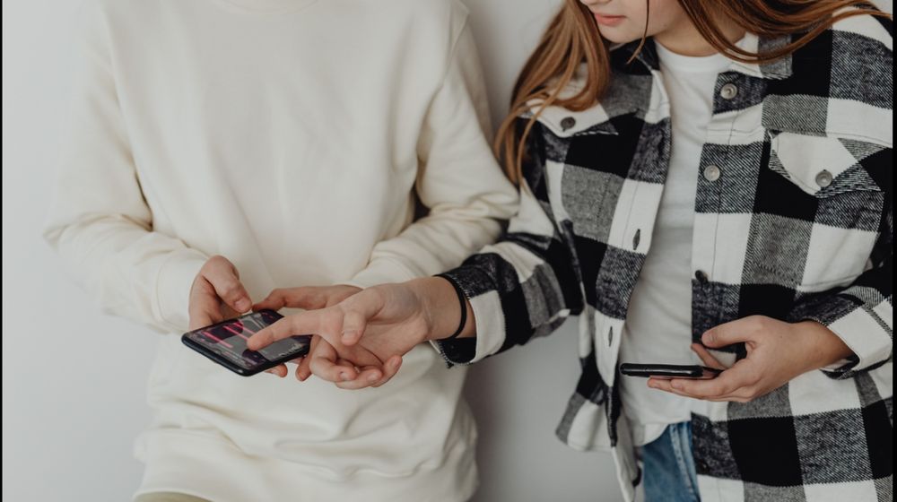 Photo by Karolina Grabowska: https://www.pexels.com/photo/young-couple-looking-at-their-smart-phones-6255975/