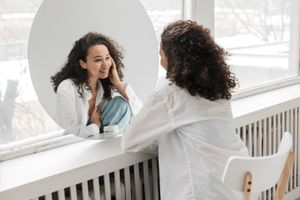 Photo by Pavel Danilyuk: https://www.pexels.com/photo/sitting-blur-reflection-face-6417918/