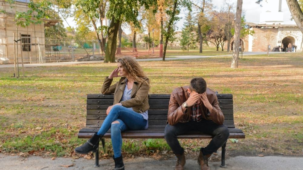 Photo by Vera Arsic: https://www.pexels.com/photo/woman-and-man-sitting-on-brown-wooden-bench-984949/