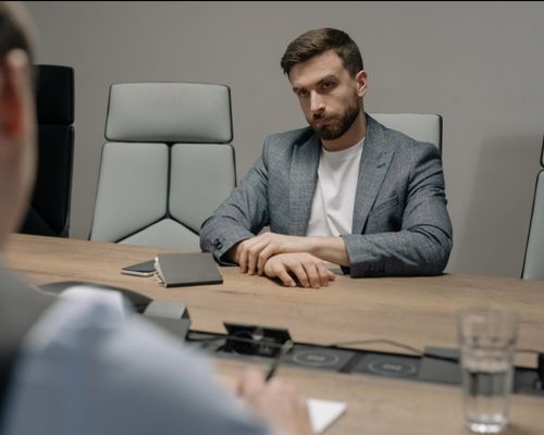 Photo by cottonbro studio: https://www.pexels.com/photo/man-wearing-gray-blazer-in-the-office-6814525/