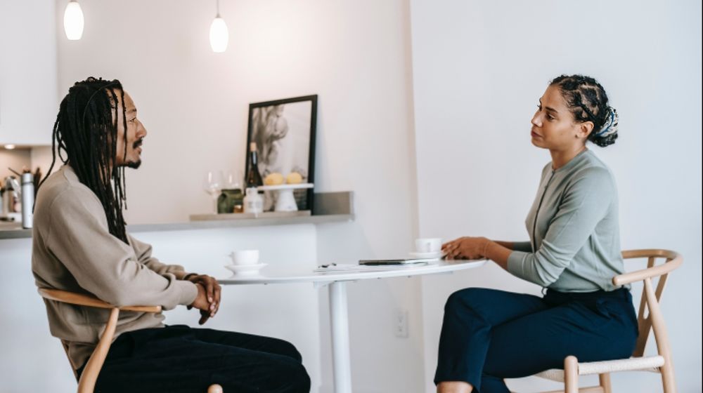 Photo by Alex Green: https://www.pexels.com/photo/black-man-sharing-problems-with-focused-female-consultant-5699485/