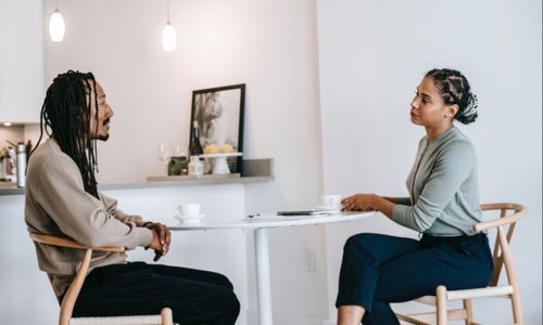 Photo by Alex Green: https://www.pexels.com/photo/black-man-sharing-problems-with-focused-female-consultant-5699485/