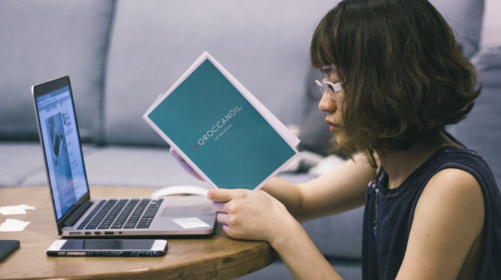 Photo by Tranmautritam: https://www.pexels.com/photo/woman-wearing-black-sleeveless-shirt-sitting-at-brown-table-92331/