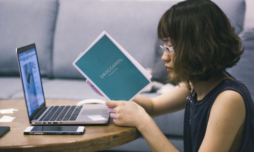 Photo by Tranmautritam: https://www.pexels.com/photo/woman-wearing-black-sleeveless-shirt-sitting-at-brown-table-92331/