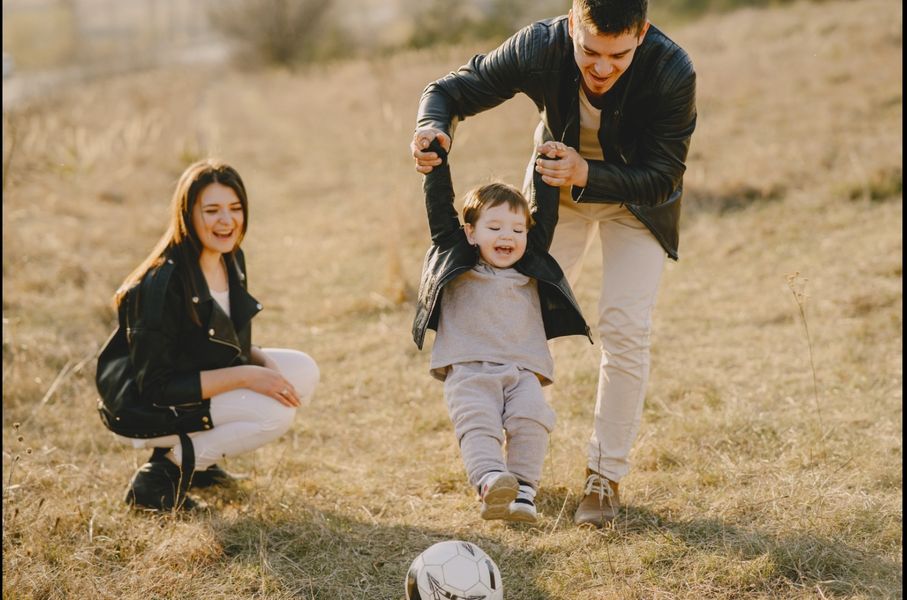 Photo by Gustavo Fring: https://www.pexels.com/photo/photo-of-family-having-fun-with-soccer-ball-4148842/