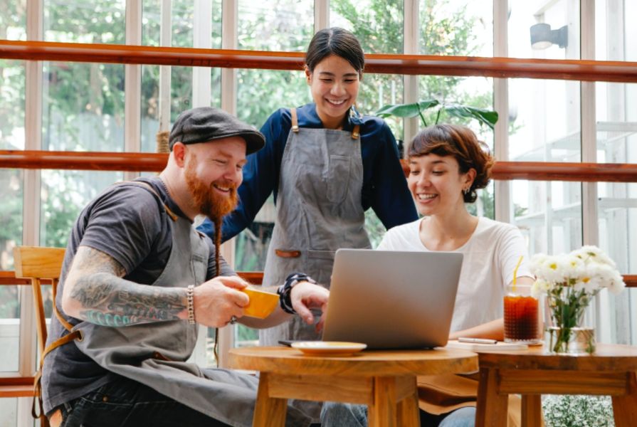 Photo by Tim Douglas : https://www.pexels.com/photo/colleagues-working-on-laptop-in-cafe-6205494/