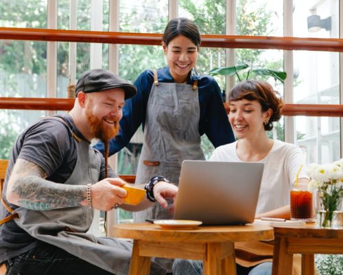 Photo by Tim Douglas : https://www.pexels.com/photo/colleagues-working-on-laptop-in-cafe-6205494/