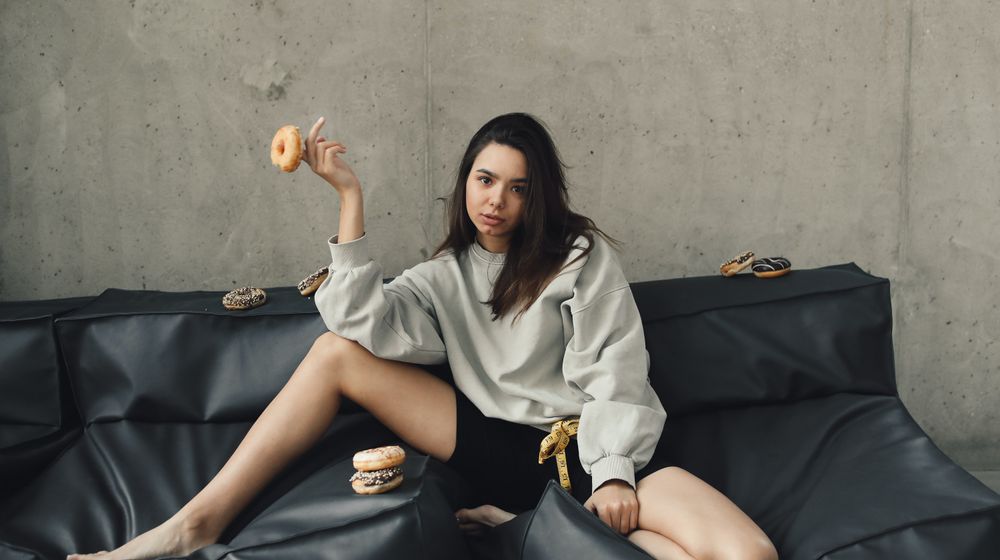Photo by Polina Tankilevitch: https://www.pexels.com/photo/photograph-of-a-woman-sitting-with-a-donut-on-her-finger-6516037/