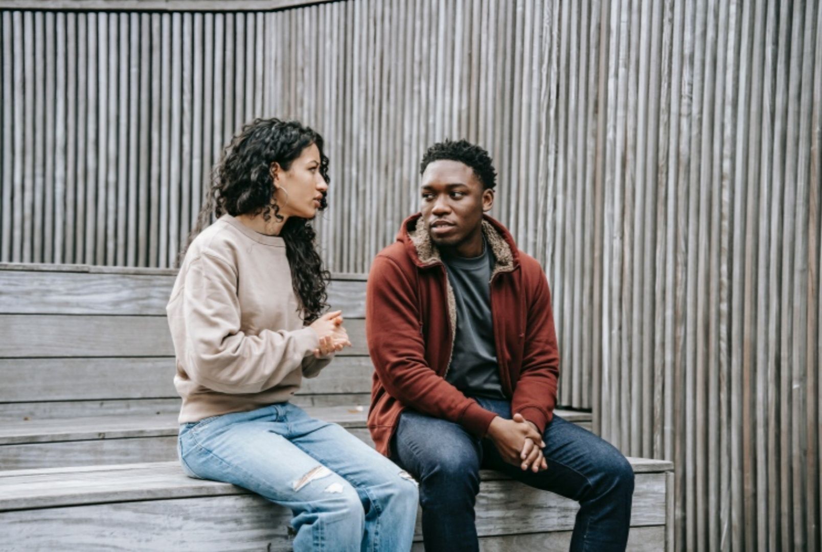 Photo by Keira Burton: https://www.pexels.com/photo/unsatisfied-multiethnic-couple-having-conversation-on-stairs-6147241/