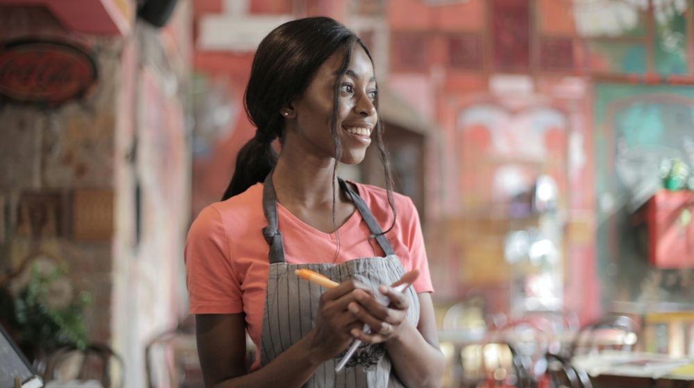 Photo by Andrea Piacquadio: https://www.pexels.com/photo/shallow-focus-photo-of-woman-smiling-while-holding-pen-and-paper-3801649/