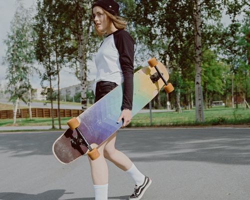 Photo by cottonbro studio: https://www.pexels.com/photo/woman-in-white-and-black-long-sleeve-shirt-holding-a-longboard-5026425/