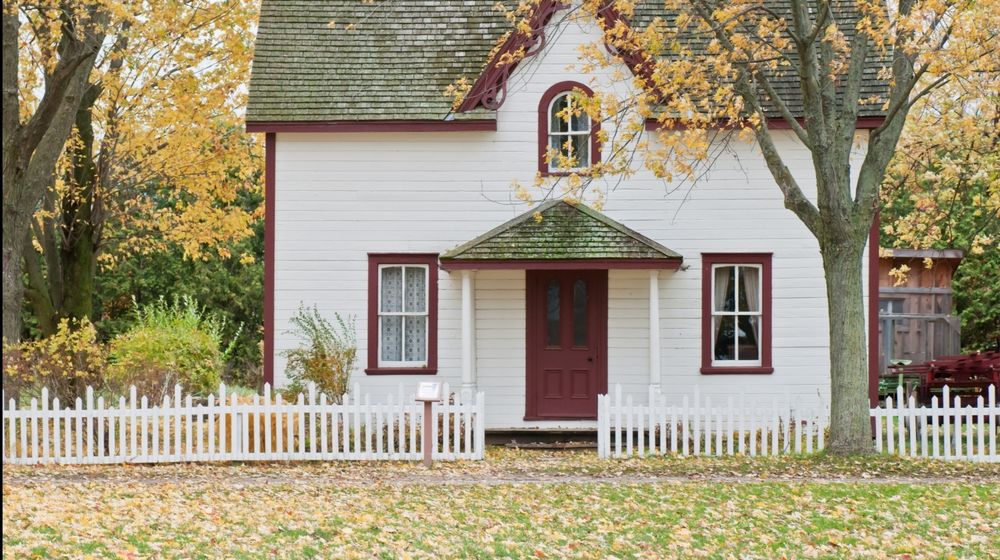 Photo by Scott Webb: https://www.pexels.com/photo/white-and-red-wooden-house-with-fence-1029599/