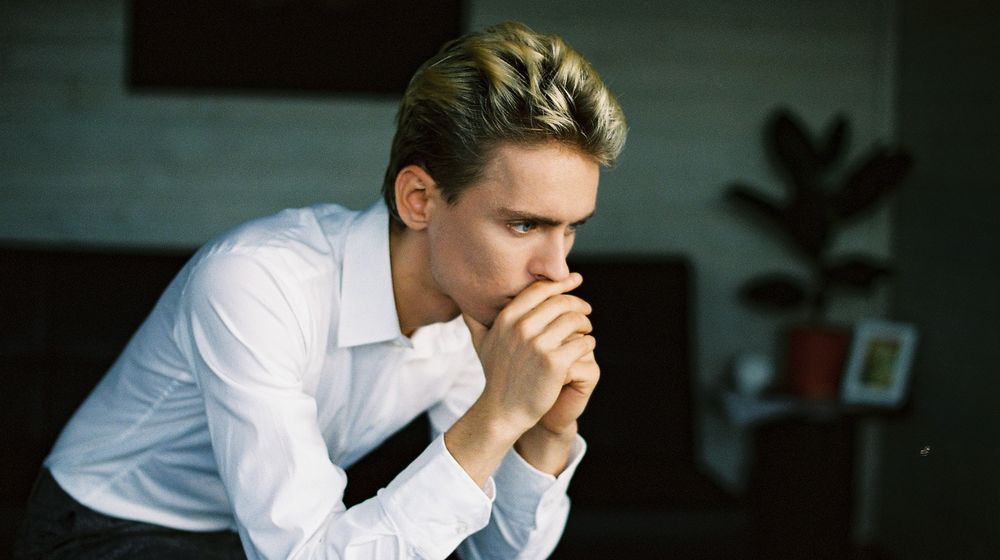 Photo by Anastasiya Vragova: https://www.pexels.com/photo/nervous-young-man-leaning-on-hand-and-thinking-in-room-6770739/