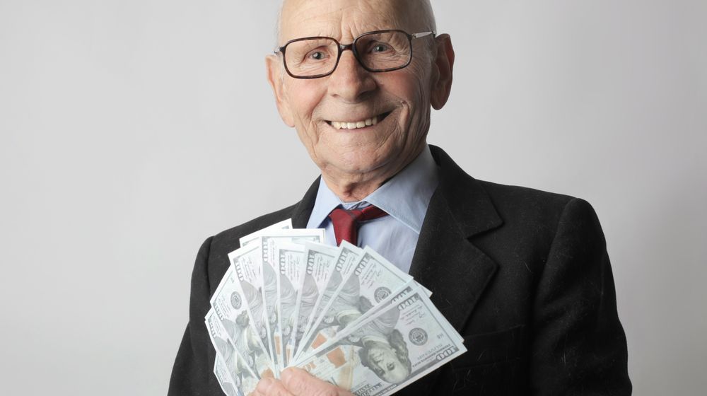 Photo by Andrea Piacquadio: https://www.pexels.com/photo/man-in-black-suit-holding-dollar-bills-3831181/