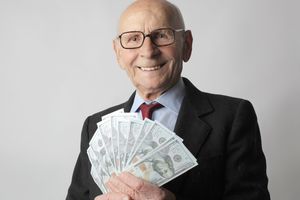 Photo by Andrea Piacquadio: https://www.pexels.com/photo/man-in-black-suit-holding-dollar-bills-3831181/