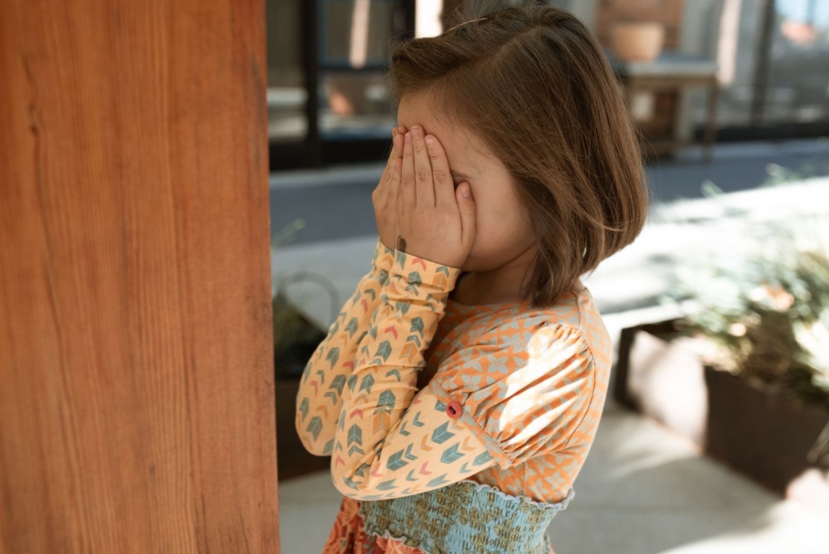 Photo by RDNE Stock project: https://www.pexels.com/photo/girl-in-multi-colored-long-sleeve-shirt-covering-her-face-6182311/