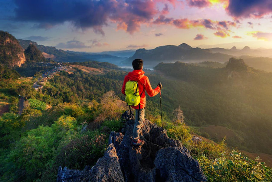backpacker-standing-sunrise-viewpoint-ja-bo-village-mae-hong-son-province-thailand_335224-1356.webp