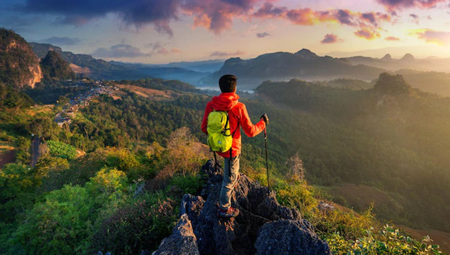 backpacker-standing-sunrise-viewpoint-ja-bo-village-mae-hong-son-province-thailand_335224-1356.webp