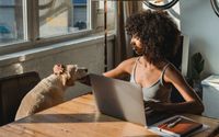 Photo by Samson Katt: https://www.pexels.com/photo/black-remote-worker-with-laptop-caressing-purebred-dog-in-house-5256136/