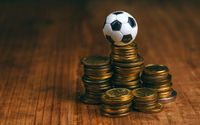 Soccer-bet-concept-with-football-and-money.png